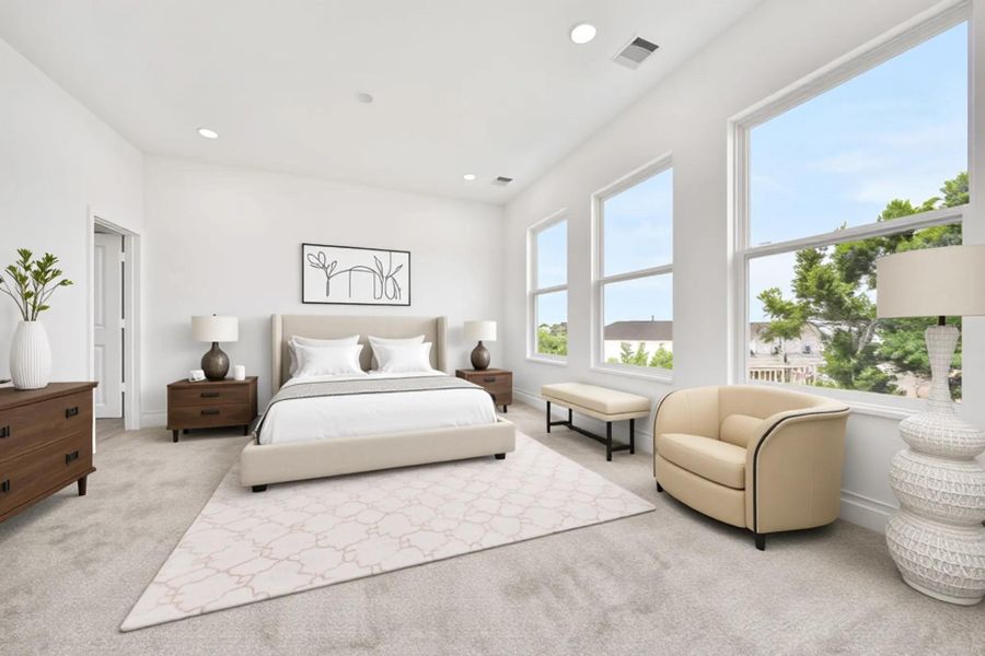 This spacious, bright bedroom features large windows providing ample natural light. It's elegantly furnished with a plush bed, cozy armchair, and modern decor. The neutral color palette and soft carpeting create a serene and inviting atmosphere.