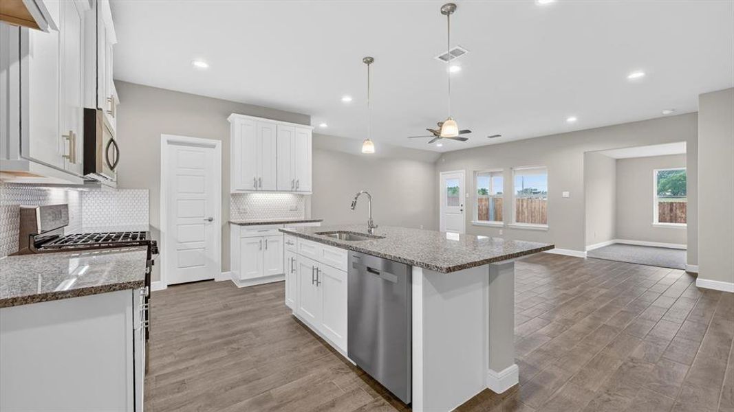 Kitchen - All Home and community information, including pricing, included features, terms, availability and amenities, are subject to change at any time without notice or obligation. All Drawings, pictures, photographs, video, square footages, floor plans, elevations, features, colors and sizes are approximate for illustration purposes only and will vary from the homes as built. Kitchen - All Home and community information, including pricing, included features, terms, availability and amenities, are subject to change at any time without notice or obligation. All Drawings, pictures, photographs, video, square footages, floor plans, elevations, features, colors and sizes are approximate for illustration purposes only and will vary from the homes as built.
