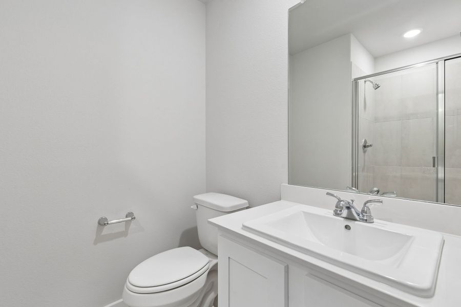 Bathroom in the Oscar home plan by Trophy Signature Homes – REPRESENTATIVE PHOTO