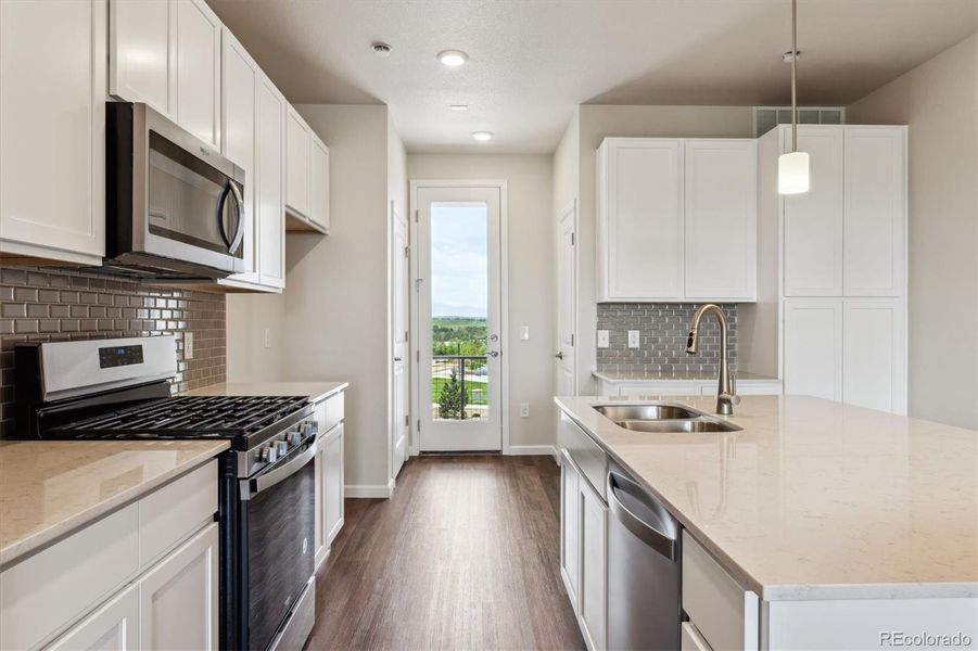 Furnished interior view inside a new home in Townhome Collection at Grand Vue at Interlocken, Broomfield (Image 9).