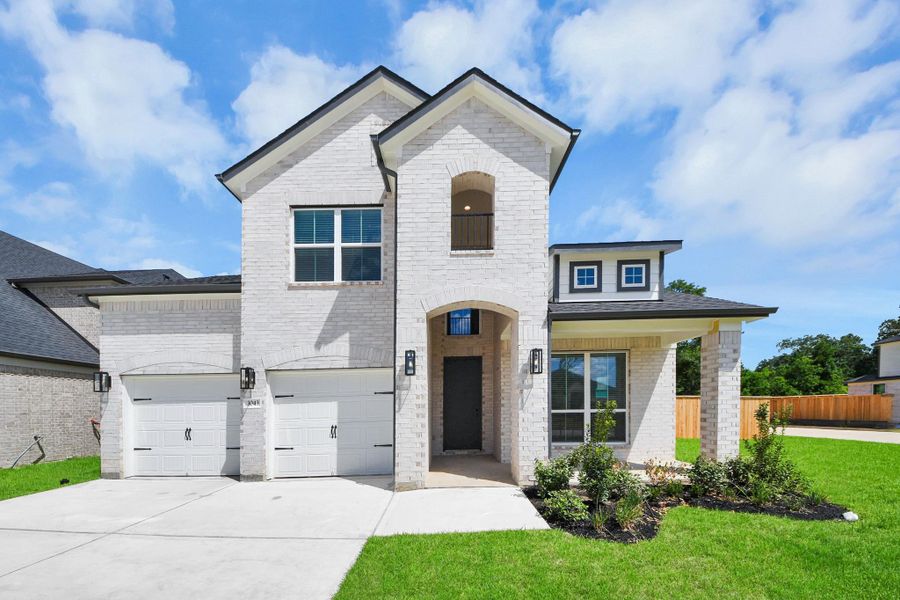 Behold a lush landscape, impeccably maintained yard, and a premium elevation adorned with captivating brick and stone features. Behold a lush landscape, impeccably maintained yard, and a premium elevation adorned with captivating brick and stone features.