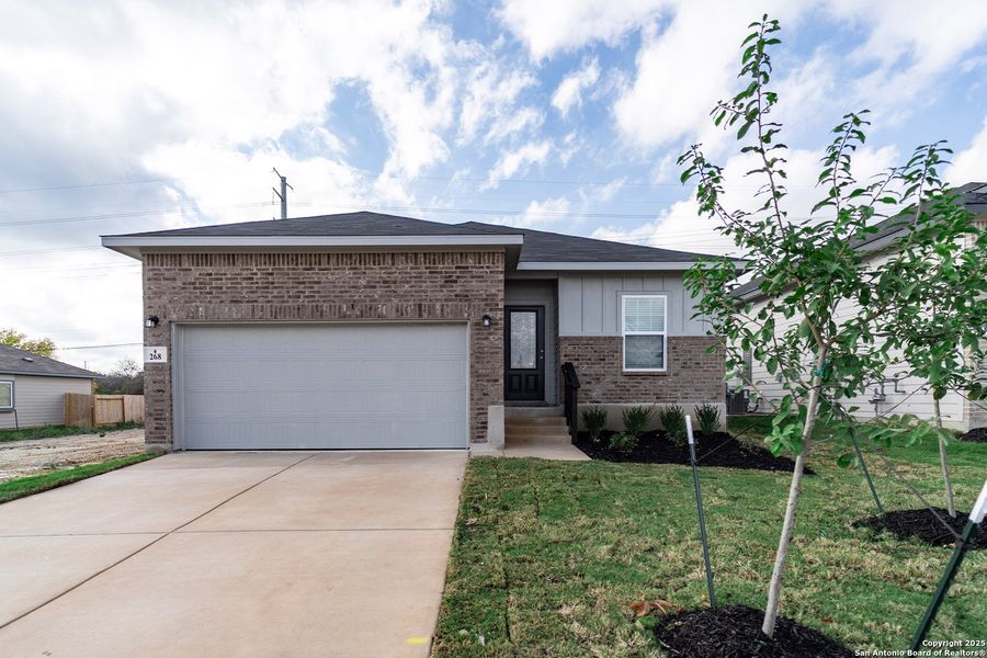 Front exterior of a new home in Hunter's Ranch, San Antonio, TX, highlighting curb appeal (Image 1). Front exterior of a new home in Hunter's Ranch, San Antonio, TX, highlighting curb appeal (Image 1).