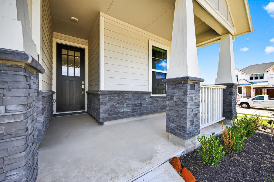 Exterior details and patio area of a home in Jordan Ranch: Signature Series, Katy (Image 28).