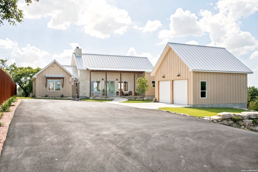 Front exterior of a new home in , Boerne, TX, highlighting curb appeal (Image 1). Front exterior of a new home in , Boerne, TX, highlighting curb appeal (Image 1).