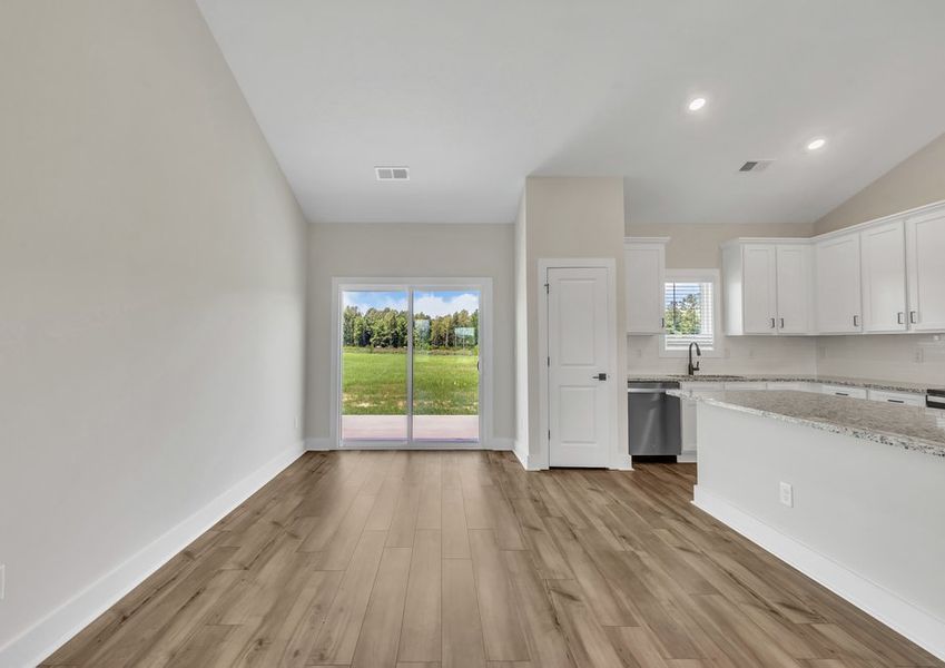 The dining area opens to the backyard.