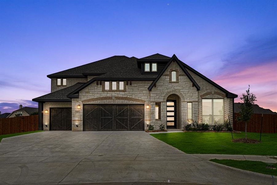 Front exterior of a new home in Sunrise at Garden Valley 60-79, Waxahachie, TX, highlighting curb appeal (Image 2).