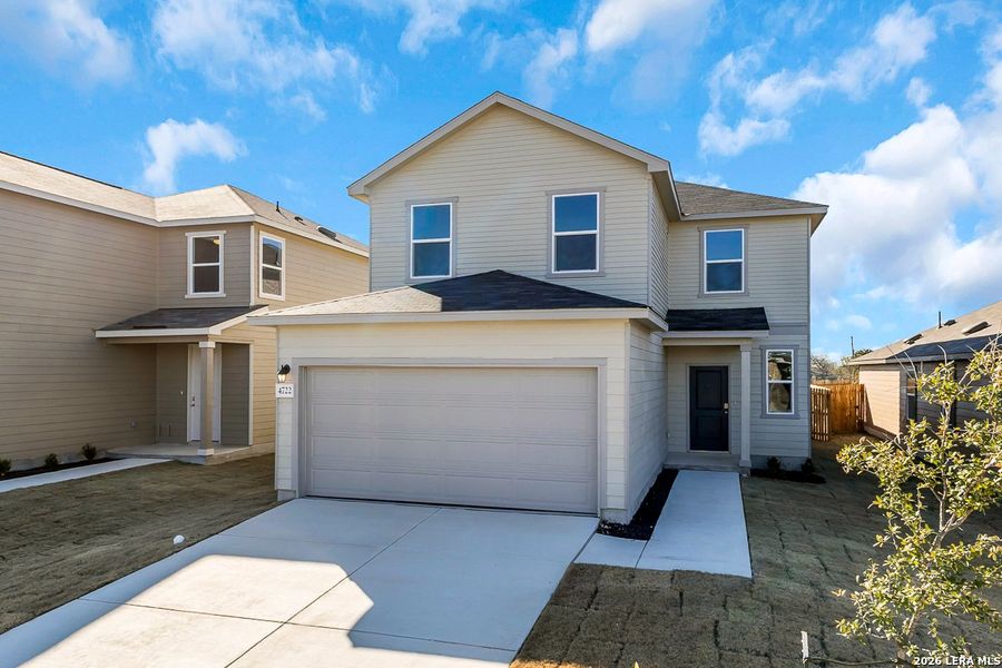 Front exterior of a new home in Spanish Trails, San Antonio, TX, highlighting curb appeal (Image 14).