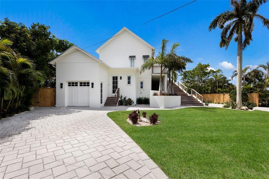 Front exterior of a new home in , Bradenton Beach, FL, highlighting curb appeal (Image 20).