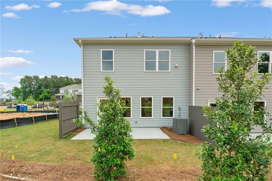 Front exterior of a new home in Wilkins Walk, Mableton, GA, highlighting curb appeal (Image 1).