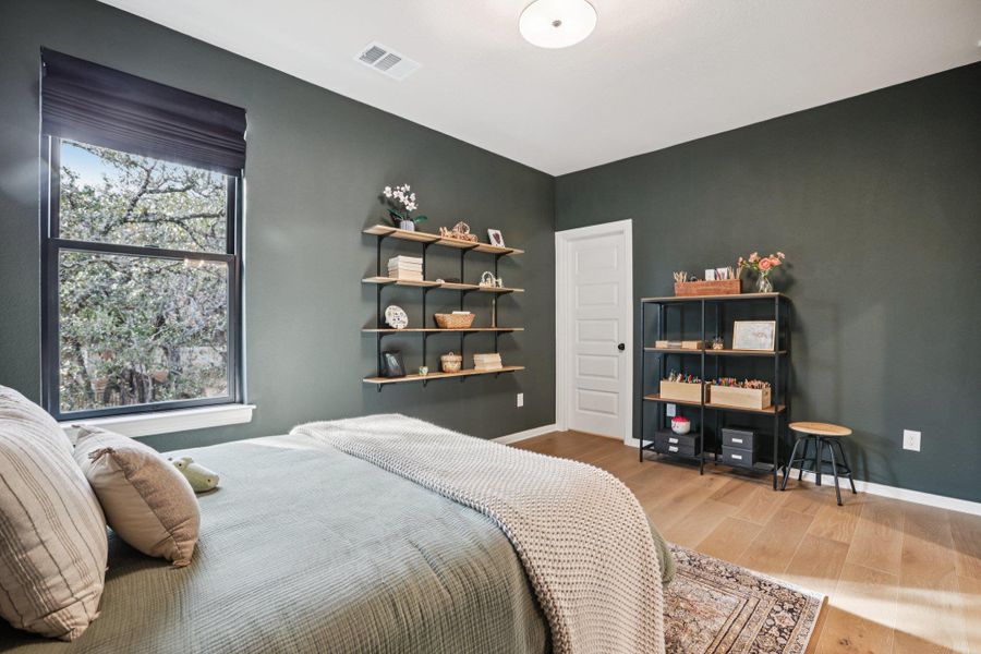 The second level hosts two additional secondary bedrooms, each with private en-suite baths.