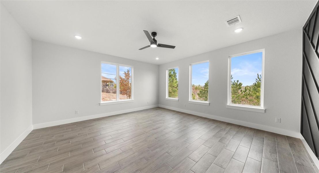 Unfurnished room with wood tiled floors, a ceiling fan, and recessed lighting
