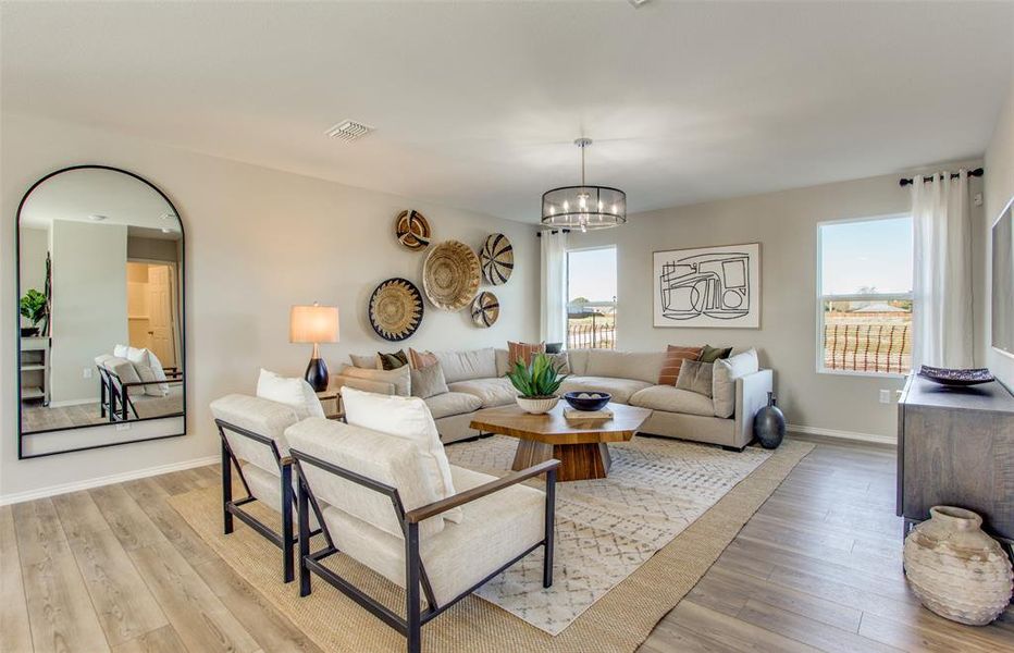 Sunlit gathering room designed for relaxation and entertainment *Model representation