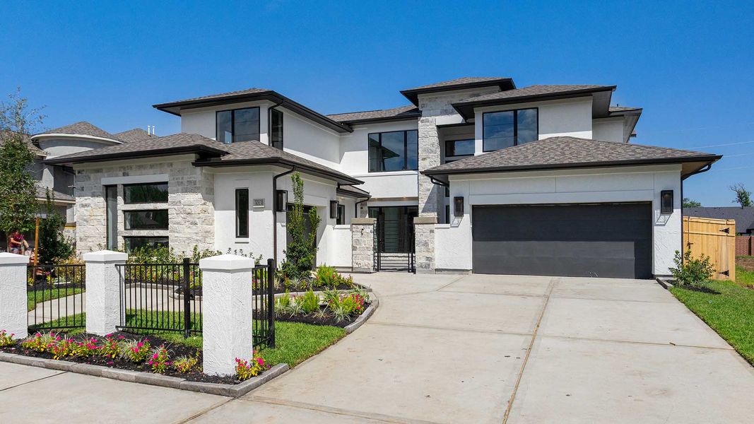 Front exterior of a new home in Sienna, Missouri City, TX, highlighting curb appeal (Image 1). Front exterior of a new home in Sienna, Missouri City, TX, highlighting curb appeal (Image 1).