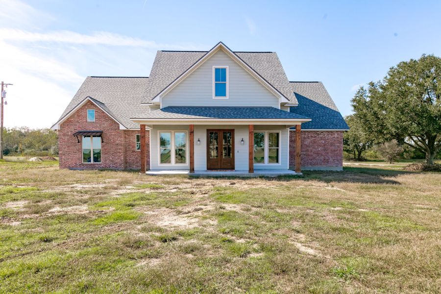 Representative exterior photo of a completed home built from the The Champagne by Manuel Builders in Chapel Bend, Montgomery, TX (Image 27). Representative exterior photo of a completed home built from the The Champagne by Manuel Builders in Chapel Bend, Montgomery, TX (Image 27).