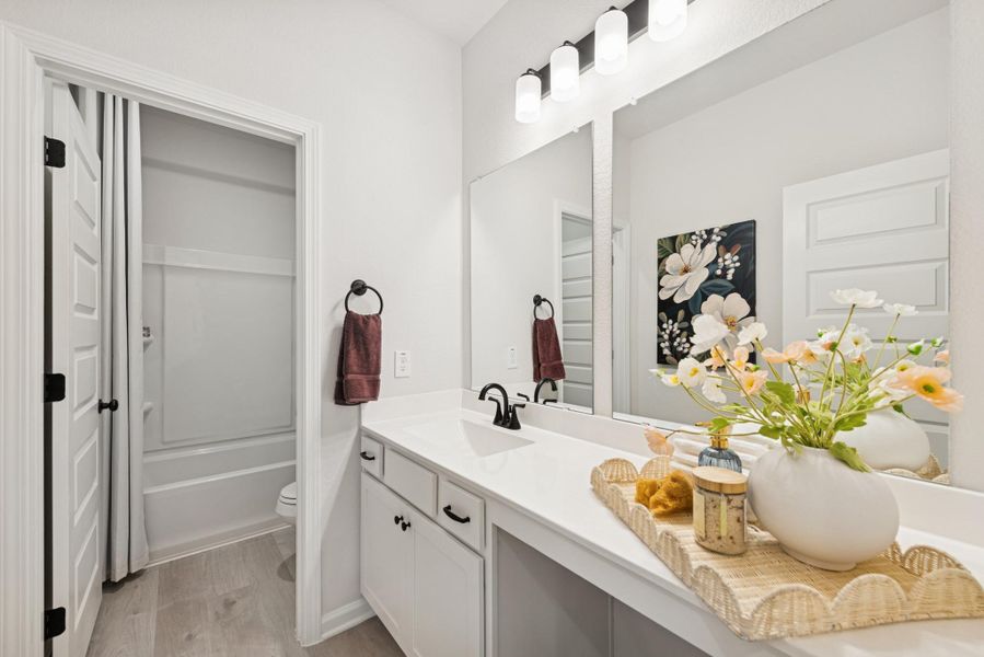 The Princeton II- Hall Bath with Dual Vanities. Staged model home shown for illustration only; actual features, colors, and upgrades may vary.