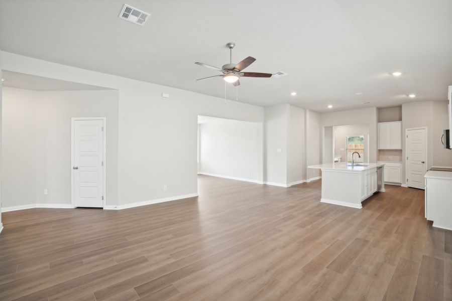 Living room and kitchen in a Rio Grande floorplan at a Meritage Homes community.
