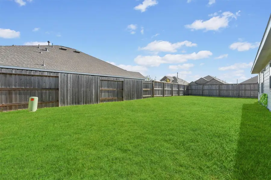 Exterior details and patio area of a home in Sterling Point at Baytown Crossings: Wildflower II Collection, Baytown (Image 2).