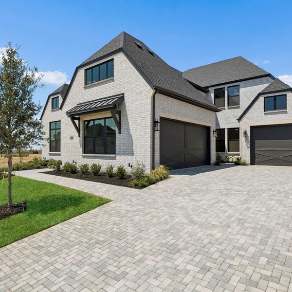 Front exterior of a new home in StarView, Prosper, TX, highlighting curb appeal (Image 26).