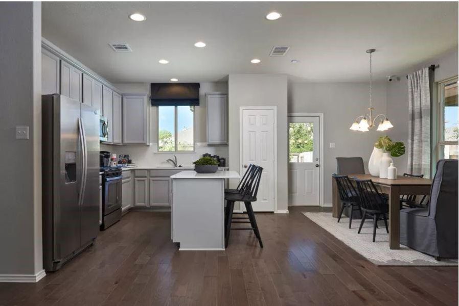 Photo of Pulte model home with same floor plan, not of actual home listed.