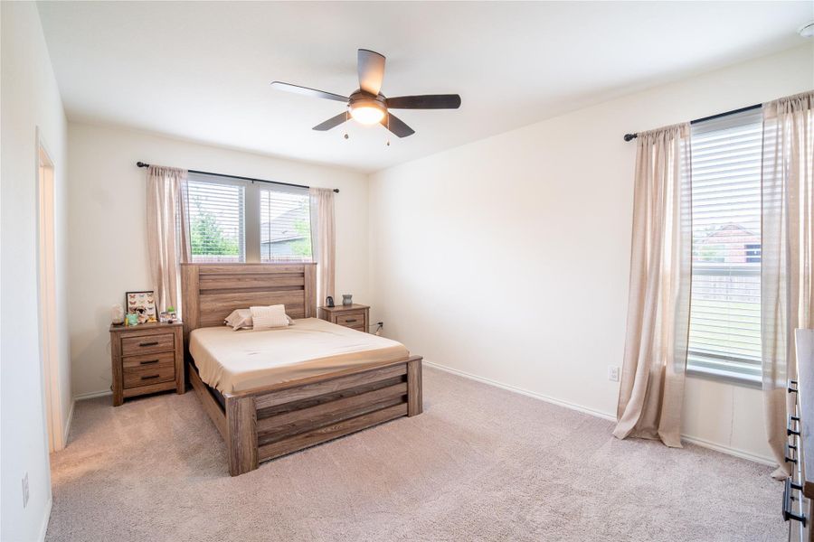 Spacious room featuring neutral carpeting and light-toned walls Spacious room featuring neutral carpeting and light-toned walls
