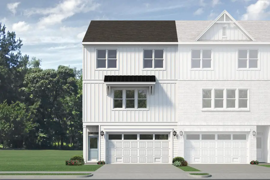 Front exterior of a new home in Anchors Bend Townes, Wilmington, NC, highlighting curb appeal (Image 9). Front exterior of a new home in Anchors Bend Townes, Wilmington, NC, highlighting curb appeal (Image 9).