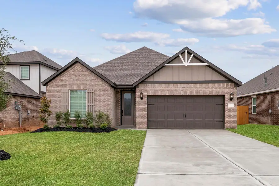 Front exterior of a new home in Magnolia Woods, Magnolia, TX, highlighting curb appeal (Image 1). Front exterior of a new home in Magnolia Woods, Magnolia, TX, highlighting curb appeal (Image 1).