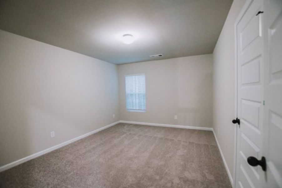Representative unfurnished interior of a home built from the Reynolds by Piedmont Residential in Hampton Ridge, Jefferson (Image 23).