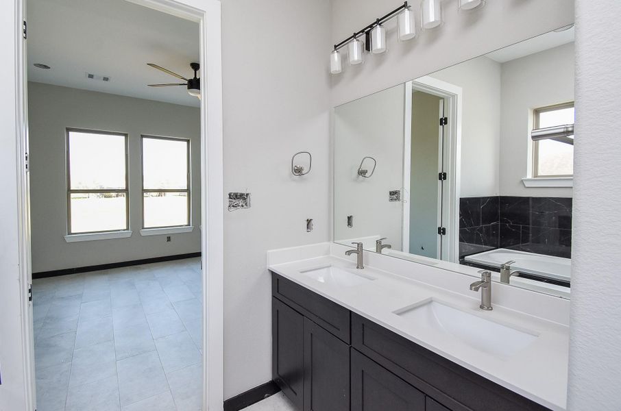 Bedroom 2 is spacious with ceiling fan. Virtually Staged Image Bedroom 2 is spacious with ceiling fan. Virtually Staged Image