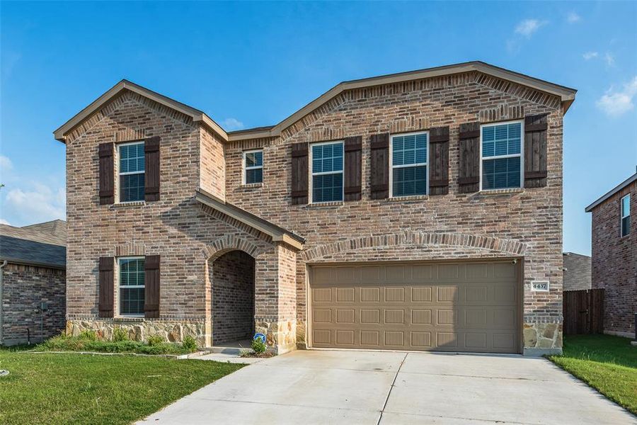 Front exterior of a new home in Newberry Point, Fort Worth, TX, highlighting curb appeal (Image 2). Front exterior of a new home in Newberry Point, Fort Worth, TX, highlighting curb appeal (Image 2).