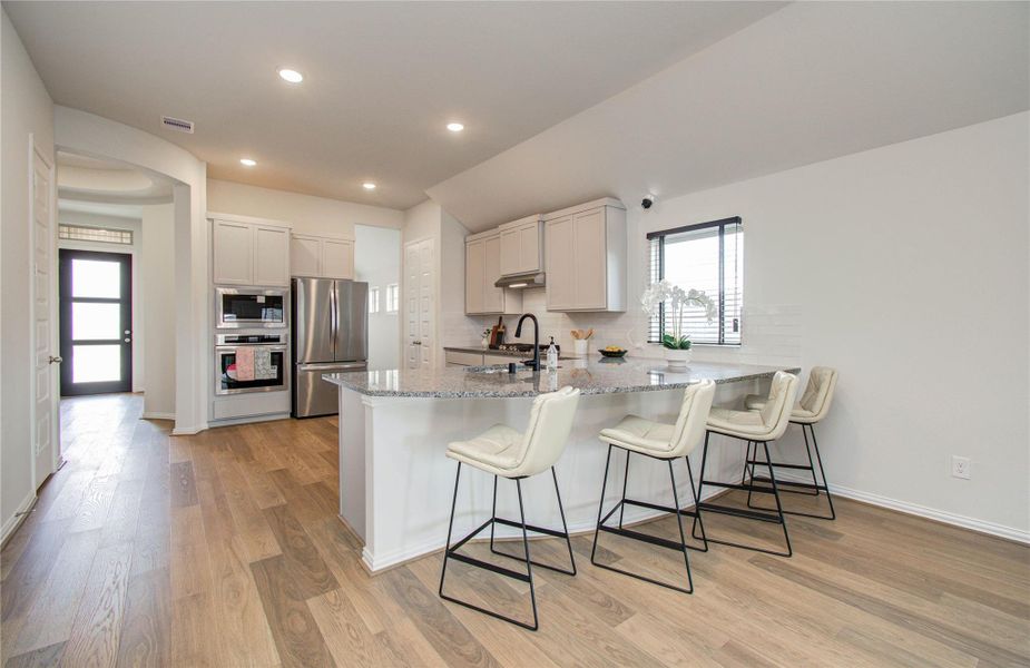 Furnished interior view inside a new home in Sunterra, Katy (Image 25).