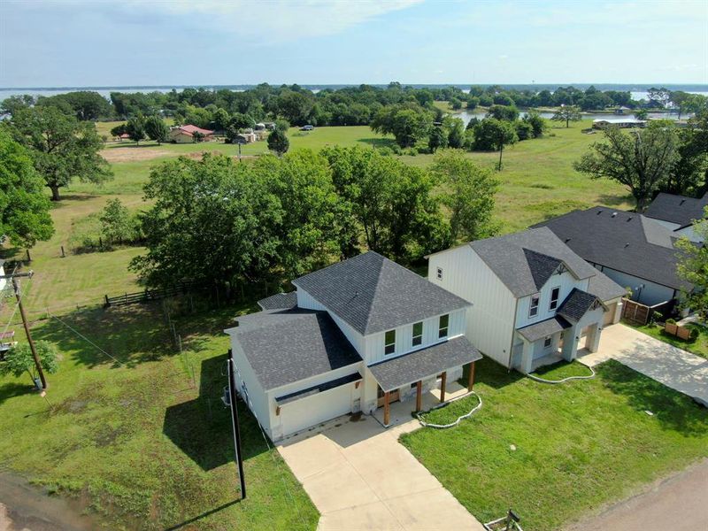 Front exterior of a new home in , Kemp, TX, highlighting curb appeal (Image 17).