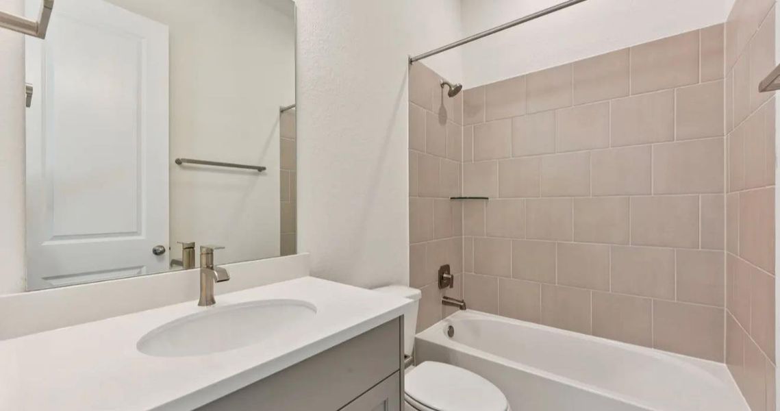 Furnished interior view inside a new home in 6 Creeks, Kyle (Image 7).