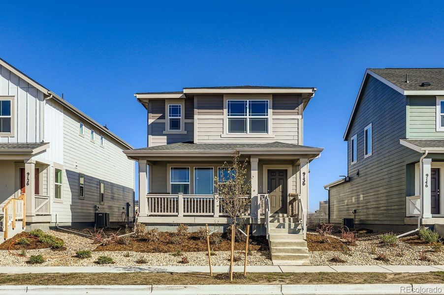 Front exterior of a new home in Percheron: The Explorer Collection, Colorado Springs, CO, highlighting curb appeal (Image 1).