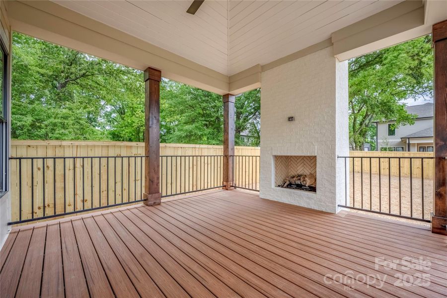 Outdoor covered porch with gas log fireplace