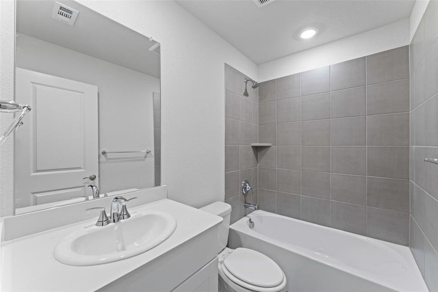 Bathroom with bathtub / shower combination and vanity Bathroom with bathtub / shower combination and vanity