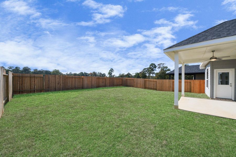 Exterior details and patio area of a home in Lexington Heights, Willis (Image 3). Exterior details and patio area of a home in Lexington Heights, Willis (Image 3).