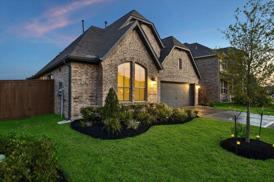 Front exterior of a new home in Edgewater, Webster, TX, highlighting curb appeal (Image 16). Front exterior of a new home in Edgewater, Webster, TX, highlighting curb appeal (Image 16).