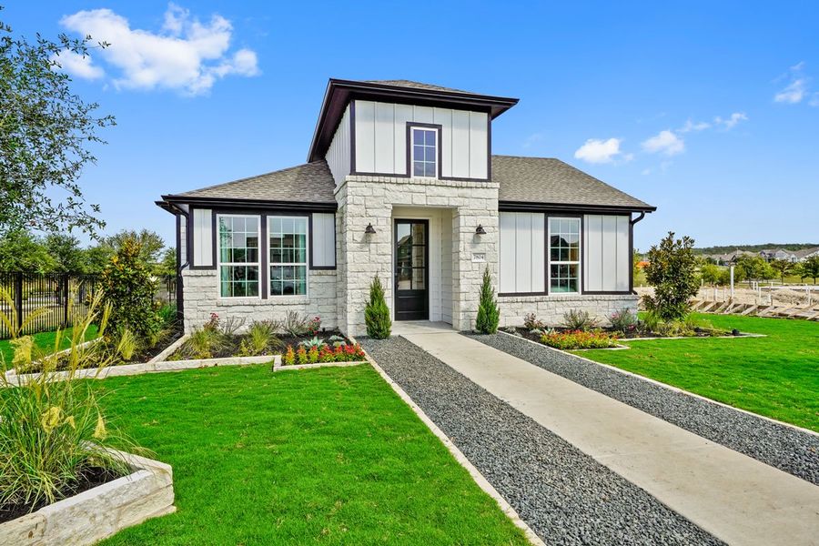 Front exterior of a new home in Easton Park, Austin, TX, highlighting curb appeal (Image 1). Front exterior of a new home in Easton Park, Austin, TX, highlighting curb appeal (Image 1).