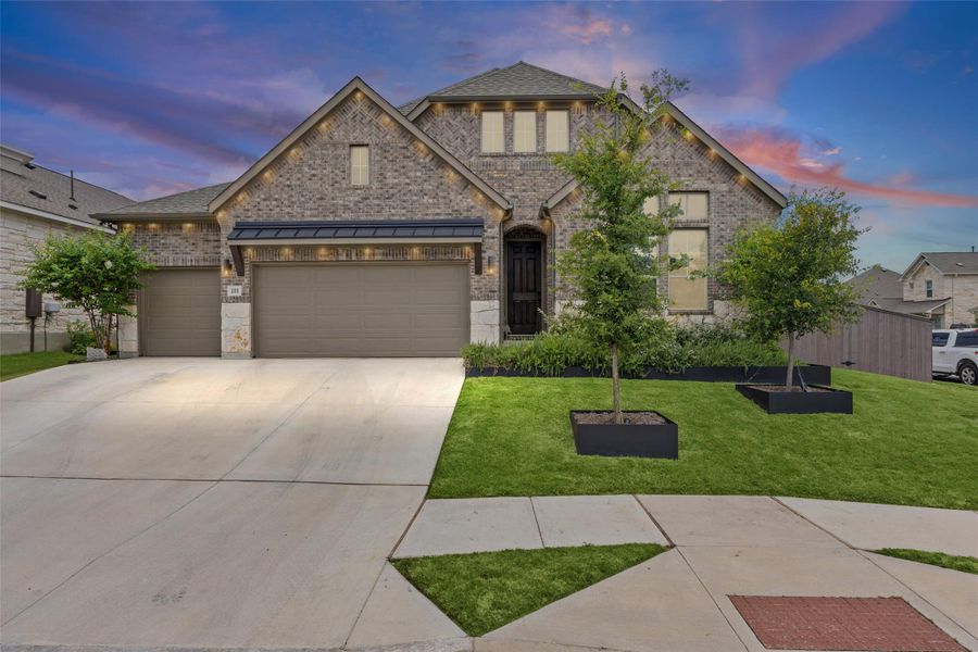 A classic brick exterior with a large driveway and landscaped front yard creates compelling curb appeal. A classic brick exterior with a large driveway and landscaped front yard creates compelling curb appeal.
