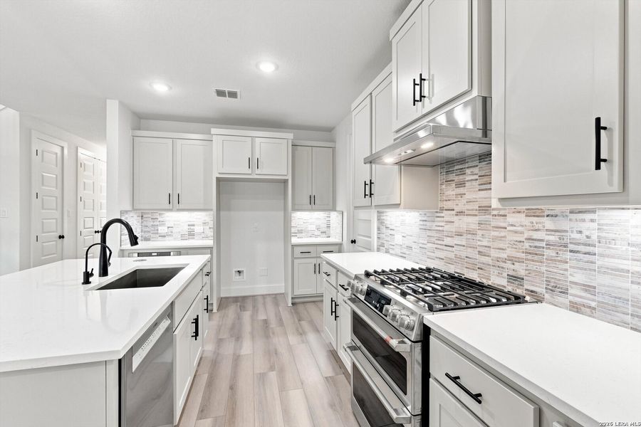 Furnished interior view inside a new home in Crown Ridge Manor, San Antonio (Image 11).