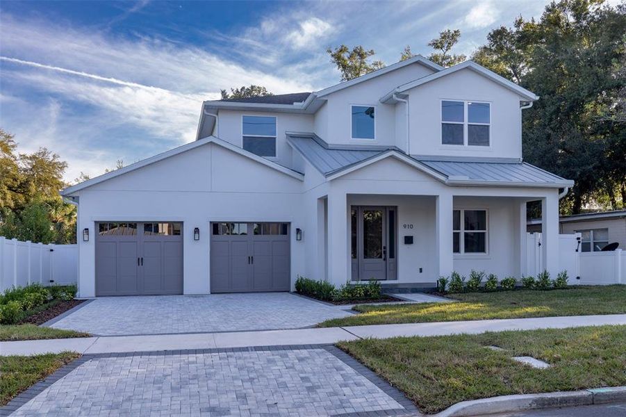 Front exterior of a new home in , Orlando, FL, highlighting curb appeal (Image 1).