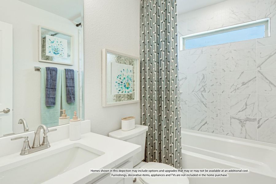 Bathroom with white vanity, marble-tiled tub and shower combo, and patterned curtain Bathroom with white vanity, marble-tiled tub and shower combo, and patterned curtain