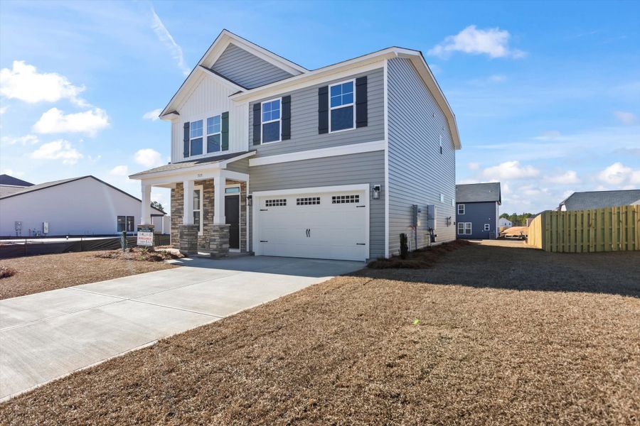 Front exterior of a new home in Portrait Hills, Aiken, SC, highlighting curb appeal (Image 22). Front exterior of a new home in Portrait Hills, Aiken, SC, highlighting curb appeal (Image 22).