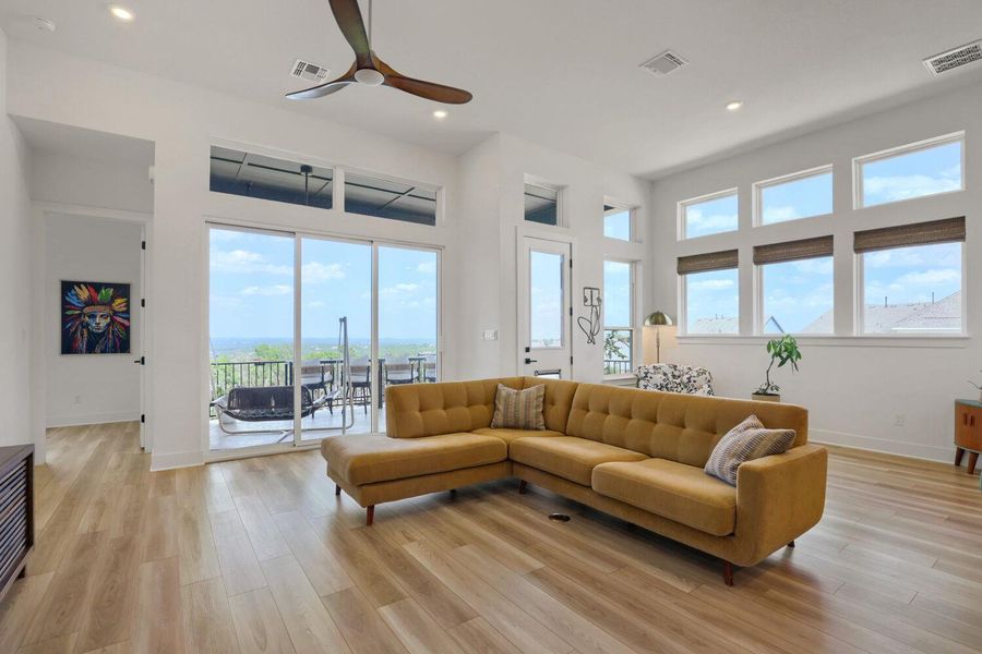 The generous windows and sliding doors offer direct balcony access and spectacular scenic views.