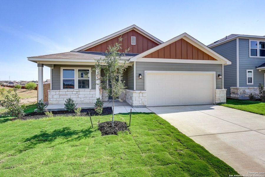 Front exterior of a new home in Cinco Lakes, San Antonio, TX, highlighting curb appeal (Image 20).