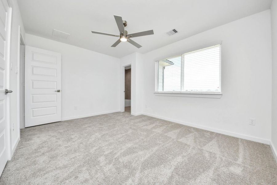 Generously sized secondary bedrooms featuring spacious closets, soft and inviting carpeting underfoot, large windows allowing plenty of natural light, and the added touch of privacy blinds for your personal retreat.