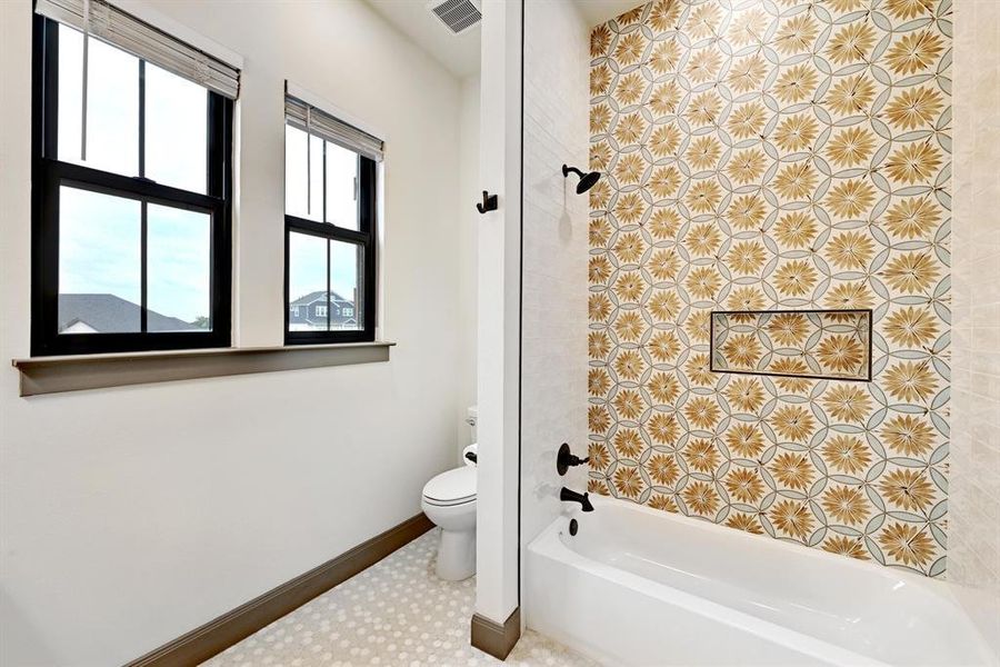 Full bath with shower / bathtub combination and toilet