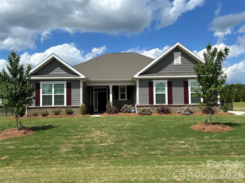 Front exterior of a new home in Yorkshire Farms, Salisbury, NC, highlighting curb appeal (Image 23). Front exterior of a new home in Yorkshire Farms, Salisbury, NC, highlighting curb appeal (Image 23).