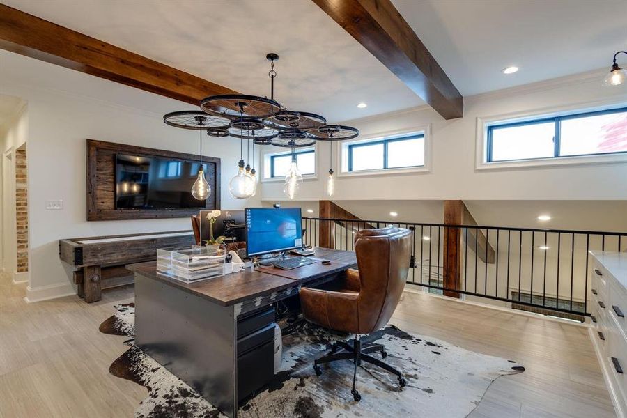 Office area featuring beamed ceiling and light hardwood / wood-style floors
