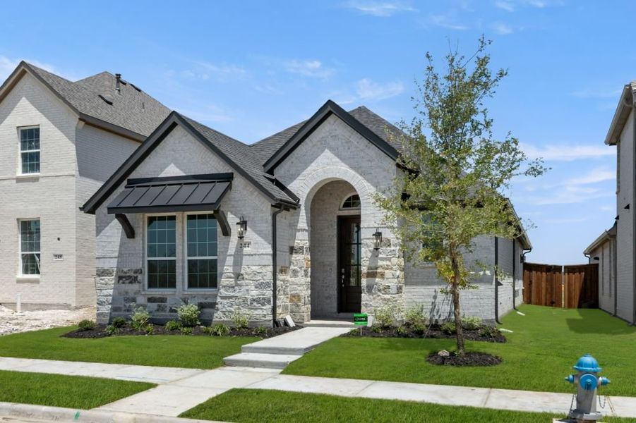 Representative exterior photo of a completed home built from the Cypress by UnionMain Homes in Edgewater, Fate, TX (Image 25).